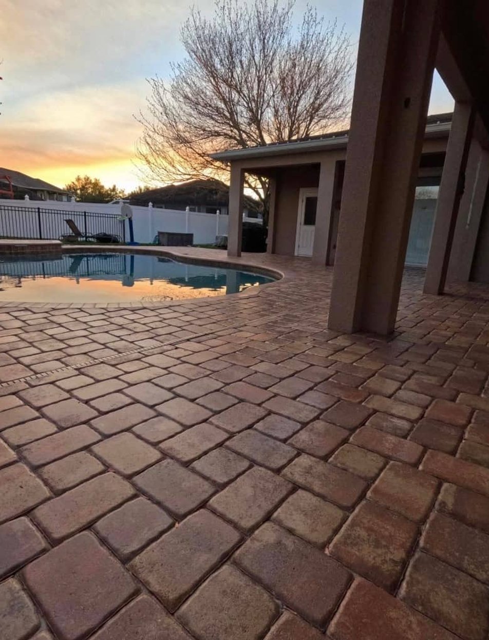 Professional paver sealing restoration on pool deck and patio