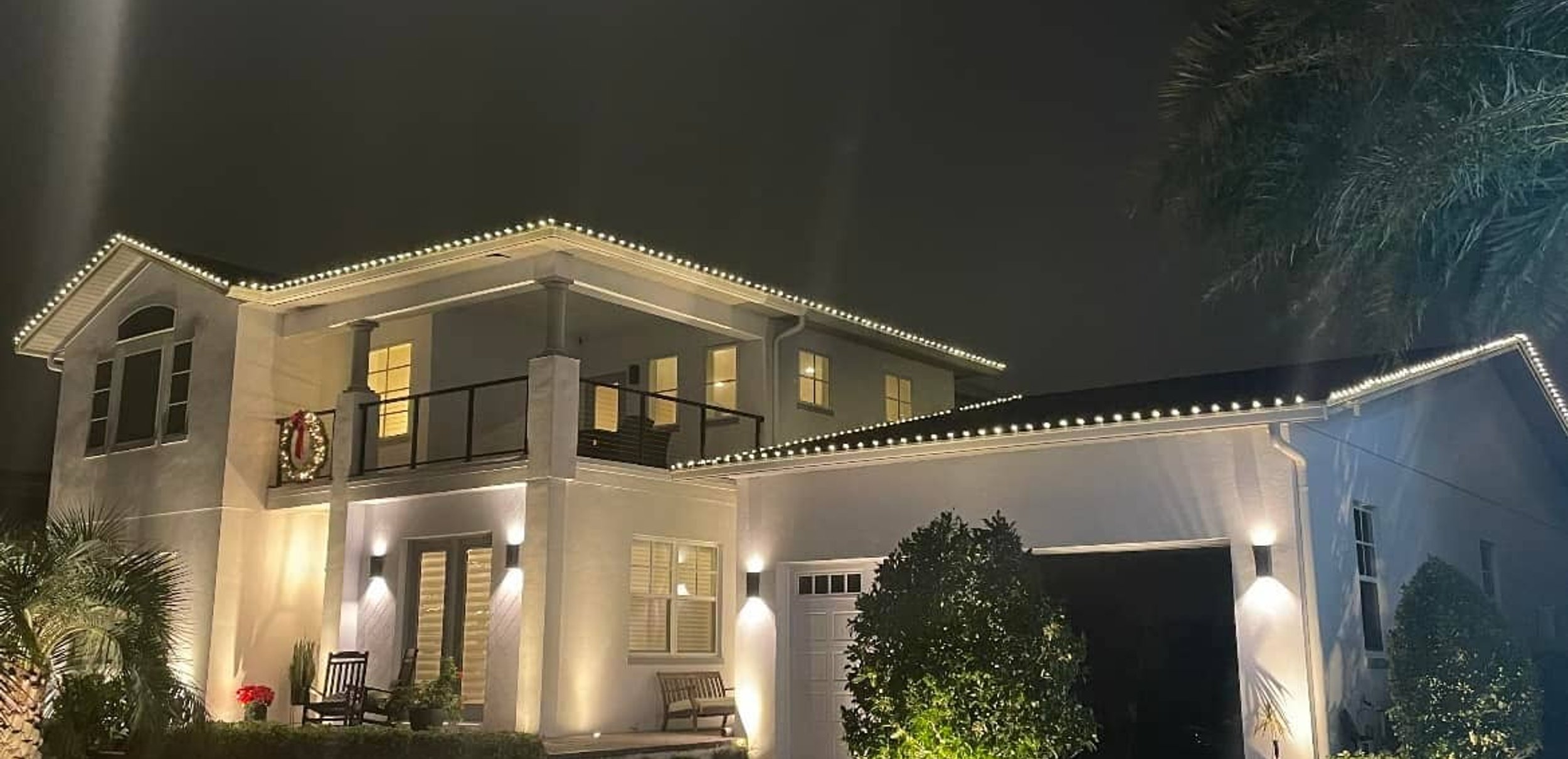 Front yard landscape lighting at night